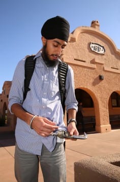 UC Davis student Harsimran Singh shows off the sash holding his kirpan, a Sikh religious item, in front of the Amtrak station Monday afternoon in downtown Davis. Singh was prevented from boarding an Amtrak bus while wearing the kirpan. Fred Gladdis/Enterprise photo
