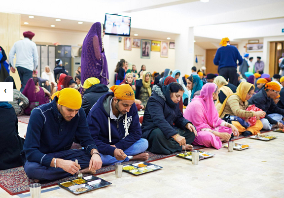 Free vegetarian food is served at the Sikh temple in Ilford, Essex. Courtesy: The Independent