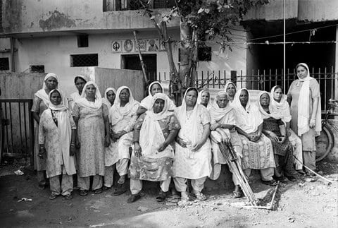 A group of women whose husbands were killed in the 1984 anti-Sikh pogrom in Trilokpuri area of East Delhi after the report of the Nanavati Commission investigating the carnage was released in February 2005.