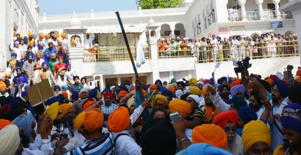 SGPC Task force volunteers and radical Sikh activists clash in the Golden Temple complex on the 30th anniversary of the army's Operation Bluestar in Amritsar on June 6, 2014. (Photo: IANS)