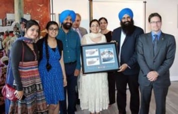 Displaying the recently-unveiled Canada Post stamp to commemorate 100th anniversary of Komagata Maru incident, State Minister (Multiculturalism) and Brampton West MP Kyle Seeback are in a group photo with family members of Baba Gurdit Singh — one of the key figures who actually chartered the Komagata Maru ship — and board members of Sikh Heritage Museum of Canada after making the funding announcement for the museum to create a unique exhibit called Lions of the Sea.