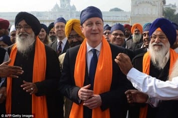Follow the leader: Mr Clegg's visit comes after the Prime Minister wore a similar outfit in Amritsar last year 