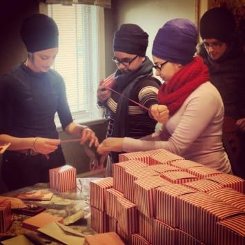 Volunteers put together care packages for women shelters