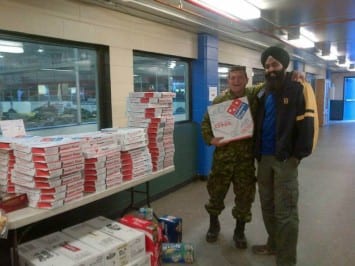 Tejinder Singh, WSO's Regional VP, providing pizzas to military personnel