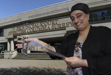 Sukhvinder Kaur Vinning, former executive director of the World Sikh Organization of Canada, holds a kirpan outside Surrey provincial court following the BC courthouse kirpan accommodation policy announcement
