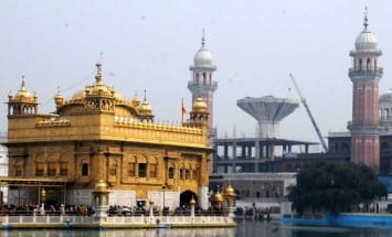 The overhead water tank that is being dismantled in the backdrop of the Golden Temple in Amritsar.