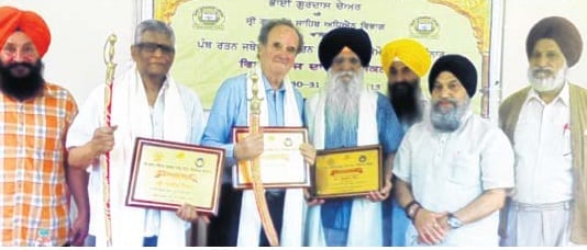 Mark Tulley and Satish Jackob being honoured by Punjabi University