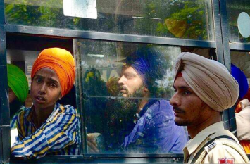 Dapinder Singh, in middle, after his arrest.