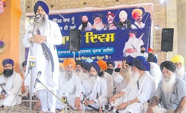 Giani Raghbir Singh addressing the Sikh sangat during program.