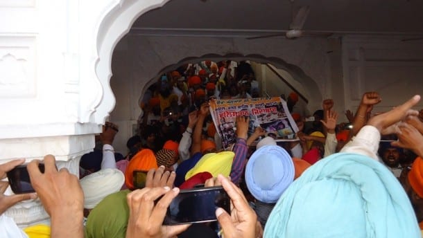 Sikh Youth Shouting Slogans of 'Khalistan-Zindabaad' displaying a banner of demolished building of Sri Akal Takht Sahib