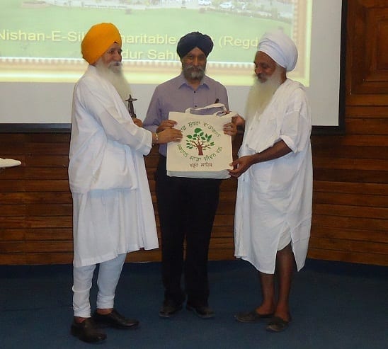 Giani Joginder Singh Vedanti and Baba Sewa Singh honouring Dr. Jasdev Singh Rai