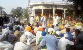 Natives Villagers staging Dharna on cross road of Village Bath