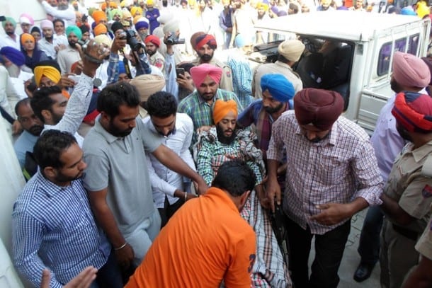 Rupinder Singh being brought to the Faridkot court complex on a wheelchair