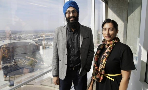 In this Dec. 11, 2015, photo, Darsh Singh, left, poses for a photo with his wife, Lakhpreet Kaur, in Dallas. It happens regularly: Someone sees a man with a turban and beard and hurls anti-Muslim slurs his way, or worse. Members of the Sikh religion, like Singh and his wife, also are feeling vulnerable as anti-Islamic sentiment heats up across the U.S., but instead of distancing themselves from Muslims, members of this southeast Asian religion are working with them to combat hateful rhetoric and dispel misconceptions about their respective faiths. (AP Photo/LM Otero)
