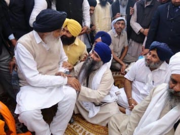 A file photo of Giani Harnam Singh Dhuma who is in feet of Parkash Badal