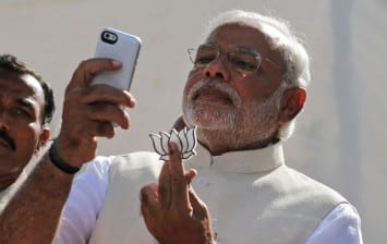 Modi displays BJP election symbol after voted
