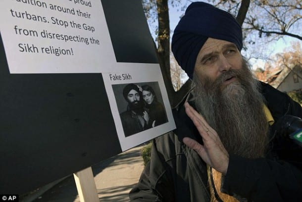 Campaign: Gursant Singh, pictured above during a protest over a GAP advert, is calling on California courts to change their weapons policy to accommodate Sikh beliefs 
